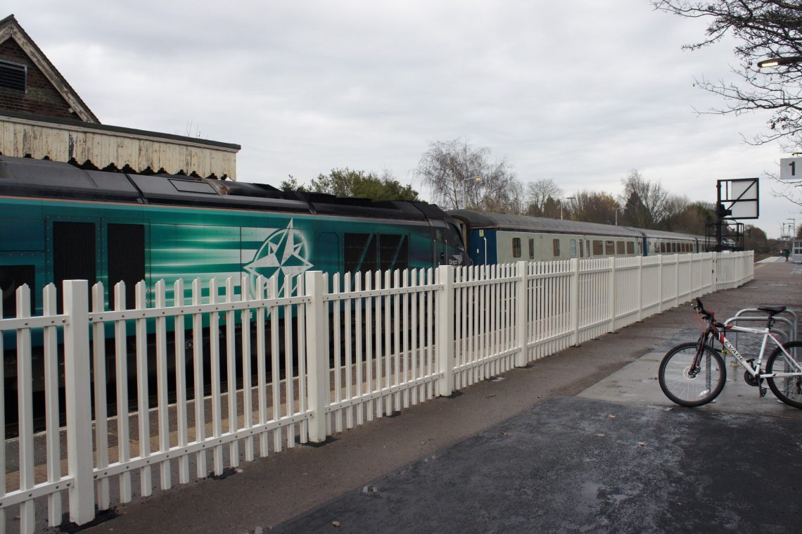 Lochrin POLYsade™ GRP palisade fencing installed to a train station.