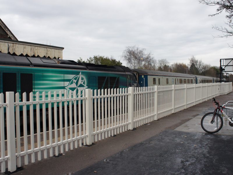 Lochrin POLYsade™ GRP palisade fencing installed to a train station.