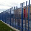 A blue Lochrin Classic fence installed around a facility.