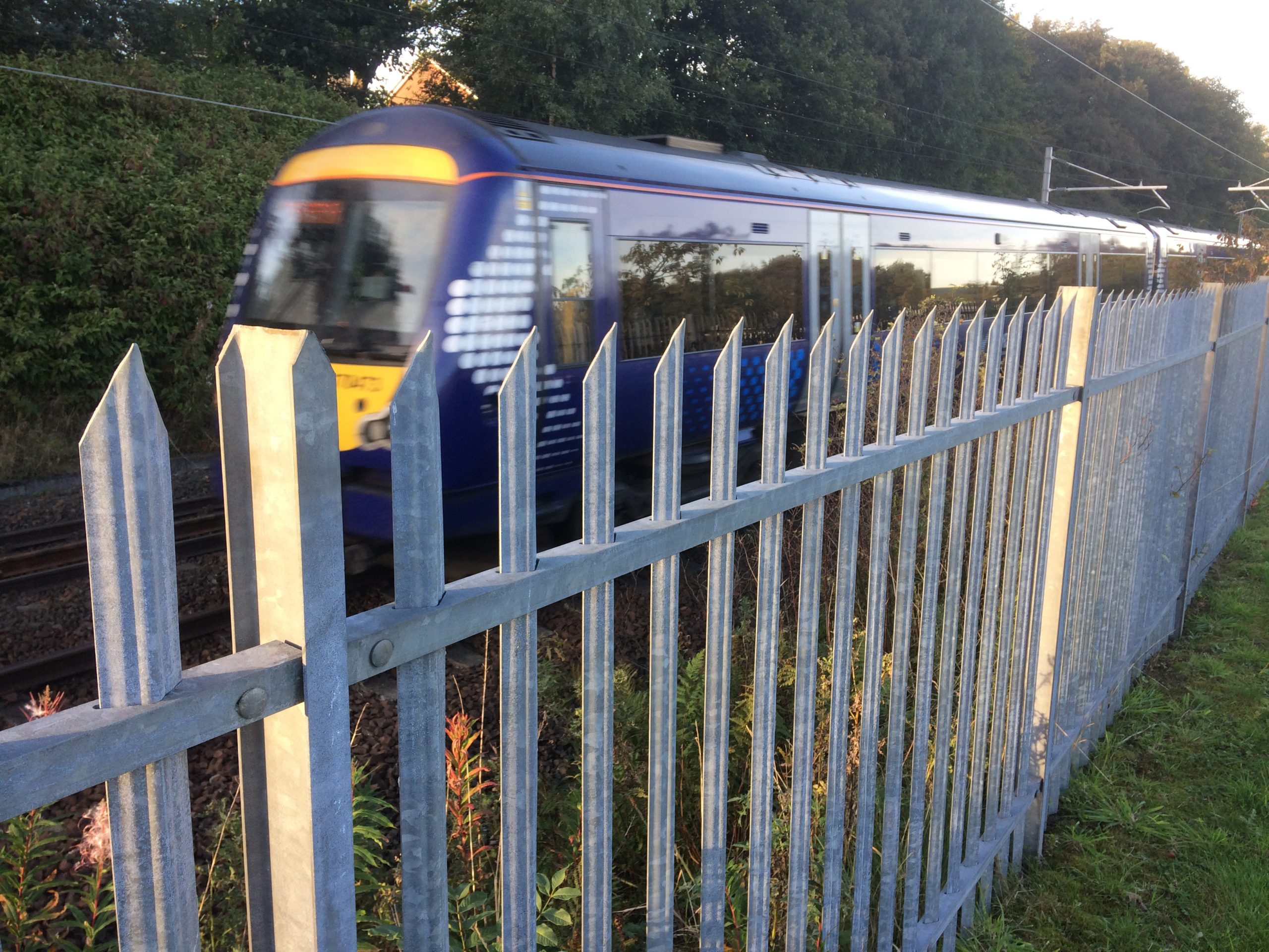 A Lochrin Classic™ fence installed alongside a railway.