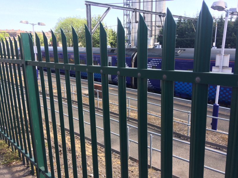 Lochrin Combi steel palisade fencing installed around a railway station in the UK.