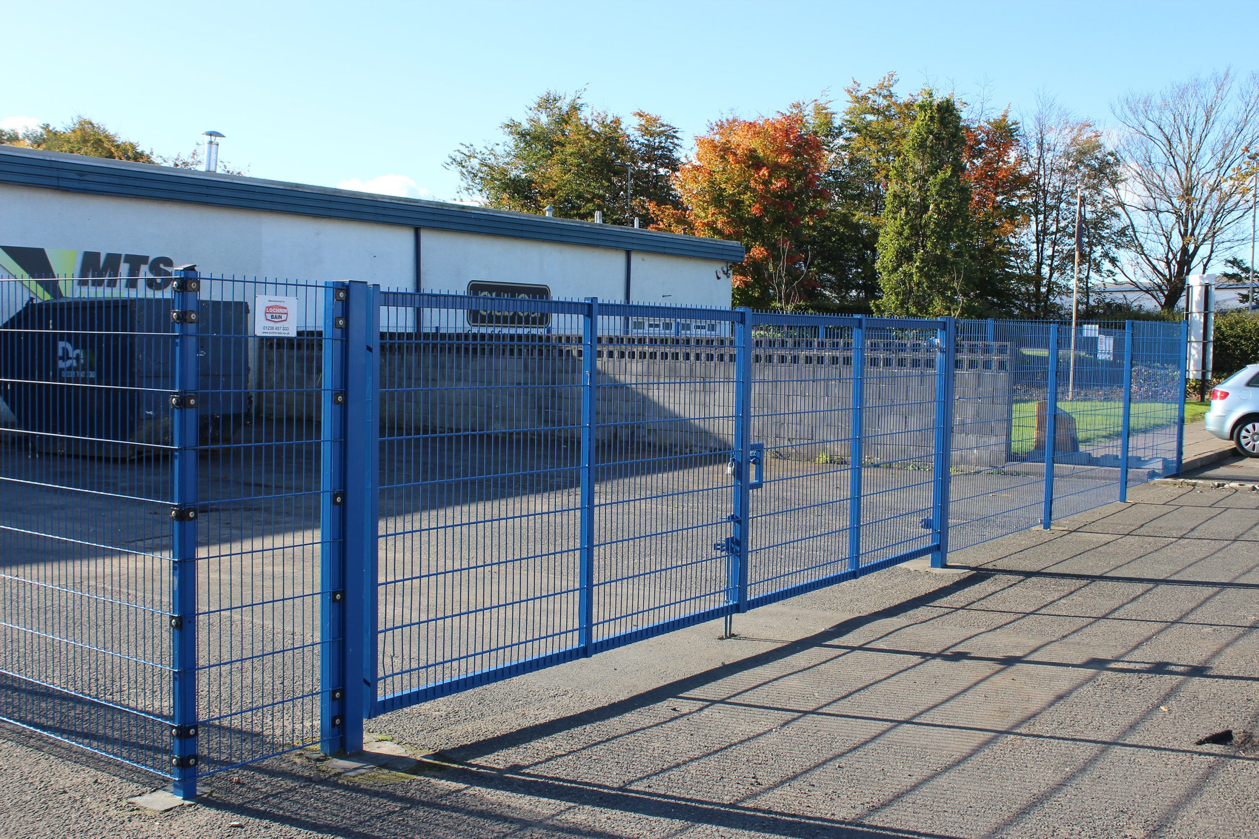 Lochrin FlatGUARD™ mesh fencing with a vehicle entry gate.