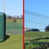 A steel palisade face next to a mesh fence, both manufactured by Lochrin Bain.