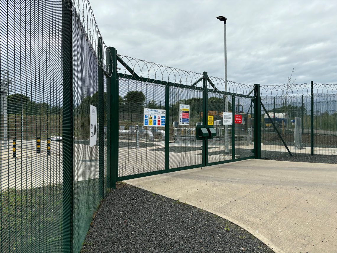 Waste water treatment works entrance gates and fencing.